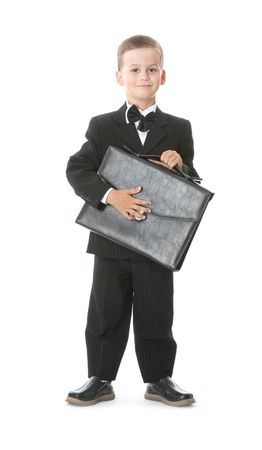 Boy holding a briefcase isolated on white backgroundの写真素材