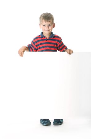 Boy holding a banner isolated on white backgroundの写真素材