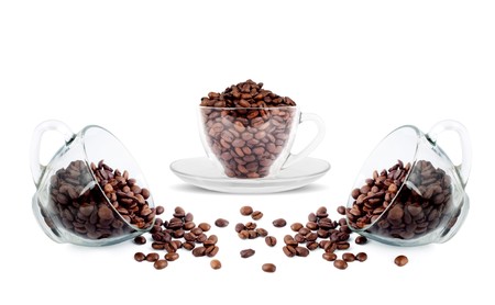 Brown roasted coffee beans isolated on white backgroundの写真素材