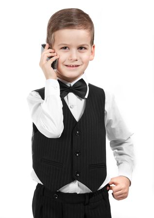 Boy holding a cellphone isolated on white backgroundの写真素材
