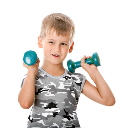 Boy holding dumbbells  isolated on white backgroundの写真素材