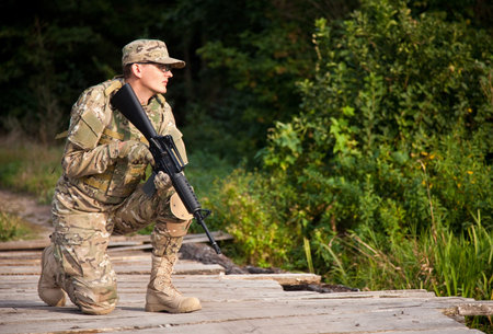 Soldier with a rifle in the field