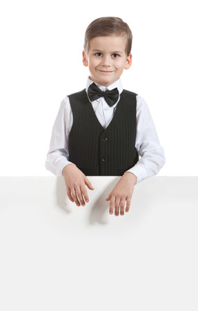 Boy holding a banner isolated on white backgroundの写真素材