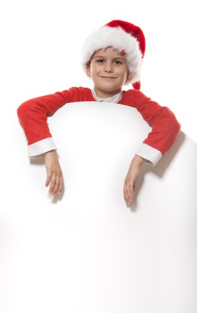 Boy holding a christmas poster isolated on white backgroundの写真素材