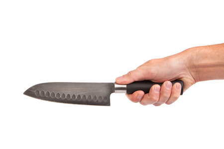 Hand is holding a kitchen kinfe isolated on a white background