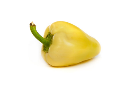 A yellow bell sweet pepper isolated on plain white background.の写真素材
