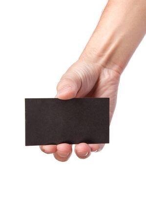 Businessman's hand holding blank paper business card, closeup isolated on white backgroundの写真素材