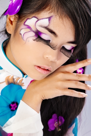 Beautiful fantasy eye face-art close-up portrait of a beautiful asian womanlの写真素材