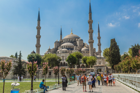 ISTANBUL - AUGUST 7: People visiting square near Sultan Ahmed Mosque, August 7, 2013 in Istanbul, Turkey. Sultan Ahmed Mosque (Blue Mosque) on of most popular tourist attractions in Istanbul.のeditorial素材