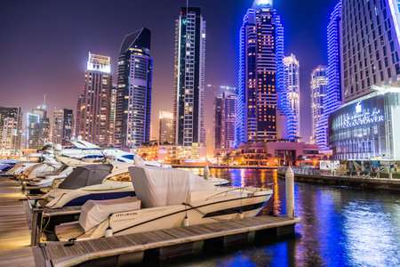 DUBAI, UAE - NOVEMBER 13: Dubai downtown night scene with city lights, luxury new high tech town in middle East, United Arab Emirates architecture. Dubai Marina cityscape, UAEのeditorial素材