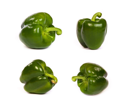 set of green sweet bell peppers isolated on plain white background.の写真素材