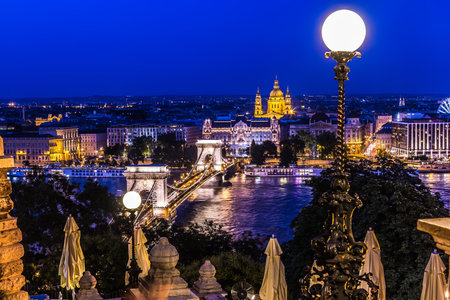 River view of Budapest at evening, illuminated Chain Bridge and Parliament Building.の写真素材