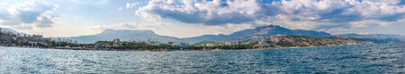 Summer view seacoast. Warm sea and beautiful nature. Yalta beach. Black Sea, Ukraineの写真素材