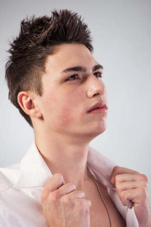 Healthy muscular young man. Isolated on grey background.の写真素材