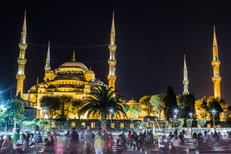 ISTANBUL - AUGUST 7: People visiting square near Sultan Ahmed Mosque at night, August 7, 2013 in Istanbul, Turkey. Sultan Ahmed Mosque (Blue Mosque) on of most popular tourist attractions in Istanbul.のeditorial素材