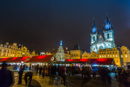 PRAGUE, CZECH REPUBLIC - DEC 17: Group of people enjoy Christmas market in Prague on December 17, 2012 in Prague. It attracts more than 750 thousands of visitors during the whole advent time.のeditorial素材