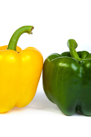 Group of seet bell peppers isolated on plain white background.の写真素材