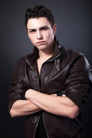 Healthy muscular young man on a black background.の写真素材