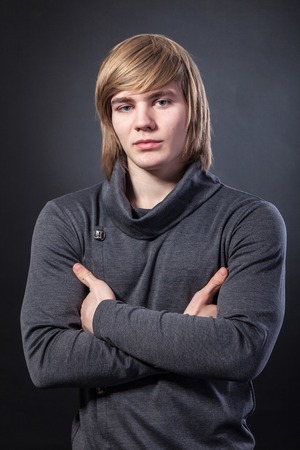 Healthy muscular young man. Isolated on grey background.の写真素材