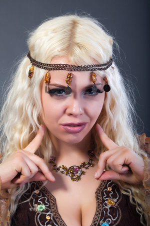 Portrait of beautiful young sexy woman with vintage make-up and hairstyle.の写真素材