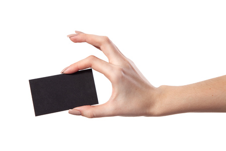 Businesswoman's hand holding blank paper business card, closeup isolated on white backgroundの写真素材