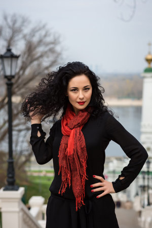Portrait Of Young Smiling Beautiful Woman in warm autumn day