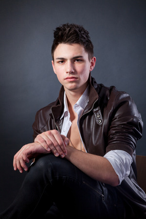 Healthy muscular young man. Isolated on grey background.の写真素材