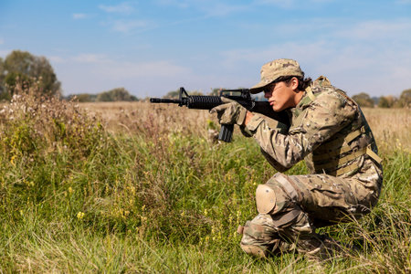 Soldier with a rifle in the field