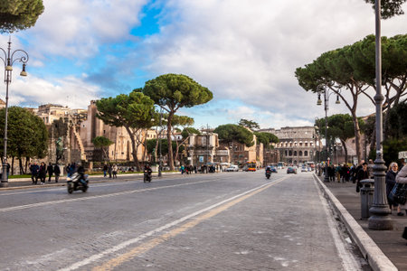 ROME -OCTOBER 21: Coliseum exterior on October 21, 2012 in Rome, Italy. The Coliseum is one of Rome's most popular tourist attractions with over 5 million visitors per year.のeditorial素材