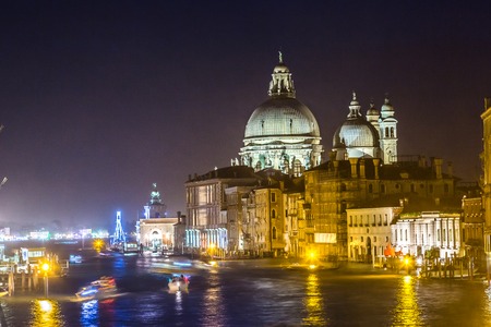 View of Basilica di Santa Maria della Salute at night under very dramatic sunset,Venice, Italyの写真素材