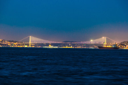 Famous Bosphorus Bridge at night from European to Asiaの写真素材