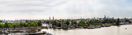 AMSTERDAM, NETHERLANDS - AUGUST 19: Canal and bridge in Amsterdam. Amsterdam is the capital and most populous city of the Netherlands on August 19, 2014のeditorial素材