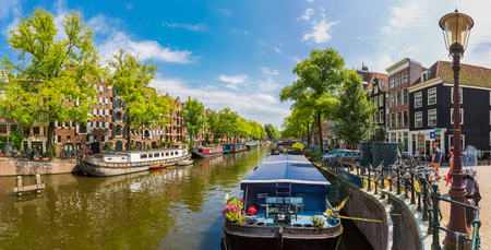 AMSTERDAM, NETHERLANDS - AUGUST 19: Canal and bridge in Amsterdam. Amsterdam is the capital and most populous city of the Netherlands on August 19, 2014のeditorial素材