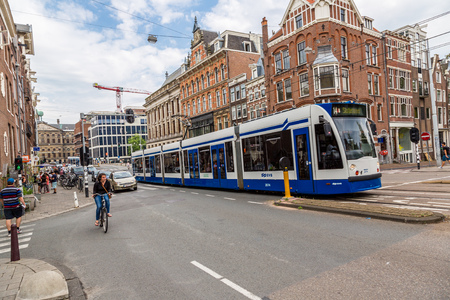AMSTERDAM, NETHERLANDS - AUGUST 19: Modern tram in Amsterdam. Amsterdam is the capital and most populous city of the Netherlands on August 19, 2014のeditorial素材