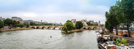 PARIS, FRANCE - JULY 14 2014: Seine and Notre Dame de Paris cathedral is one of the most visited places in France and one of the most famous symbols of Paris, July 14, 2014のeditorial素材