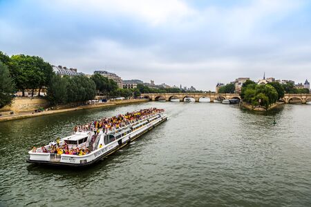 PARIS, FRANCE - JULY 14 2014: Seine and Notre Dame de Paris cathedral is one of the most visited places in France and one of the most famous symbols of Paris, July 14, 2014のeditorial素材