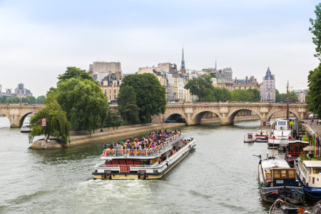 PARIS, FRANCE - JULY 14 2014: Seine and Notre Dame de Paris cathedral is one of the most visited places in France and one of the most famous symbols of Paris, July 14, 2014のeditorial素材