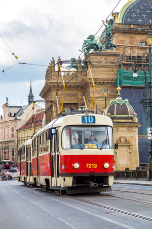 PRAGUE CZECH REPUBLIC -  JULY 21: Tram at old street in Prague, Czech Republic on July 21, 2014. Prague historical Center, including most of the city major sites, became a UNESCO-listed site in 1992.のeditorial素材