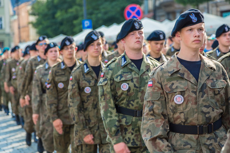 KRAKOW, POLAND - JULY 26: Polish soldiers in a historical  part of Krakow, Poland on July 26, 2014. Krakow is one of the oldest cities in Poland.のeditorial素材