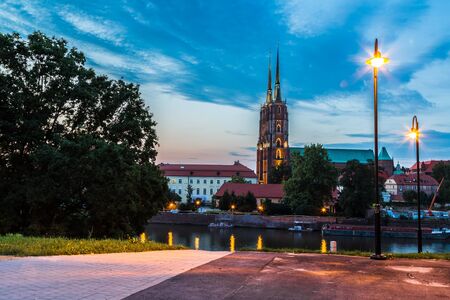 A cityscape cathedral, river Odra. Wroclaw, Poland, at duskの写真素材