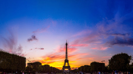 PARIS, FRANCE - JULY 14 2014: Eiffel Tower at sunset is the most visited monument in France and the...