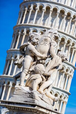 Leaning  tower in Pisa with statue of angels   in a summer day in Italyの写真素材