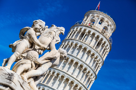 Leaning  tower in Pisa with statue of angels   in a summer day in Italyの写真素材
