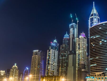 DUBAI, UAE - NOVEMBER 13: Dubai downtown night scene with city lights, luxury new high tech town in middle East. Dubai Marina cityscape,  on November 13, 2012 in Dubai, UAE.のeditorial素材