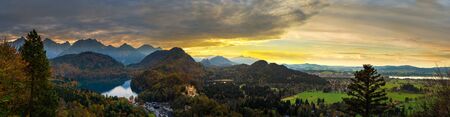Alps and lakes at sunset in Germany. Taken from the hill next to  Neuschwanstein castle.のeditorial素材
