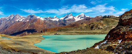 Alps mountain landscape and mountain lake in a beautiful day in Switzerlandの写真素材