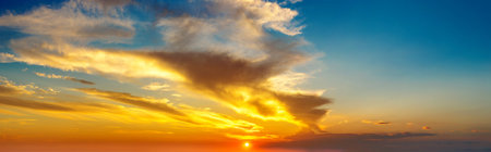 Amazing sunset panorama in a beautiful summer evening
