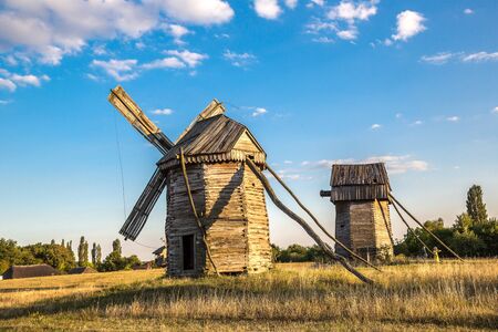 Traditional ukrainian windmill in the museum of national architecture in Pirogovo in a summer day, Kiev, Ukraineのeditorial素材