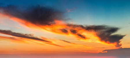 Amazing sunset panorama in a beautiful summer evening