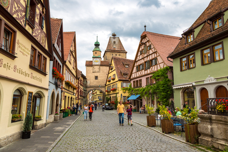 ROTHENBURG, GERMANY - JUNE 18, 2016: Medieval old street in Rothenburg ob der Tauber in a beautiful summer day, Germany on June 18, 2016のeditorial素材